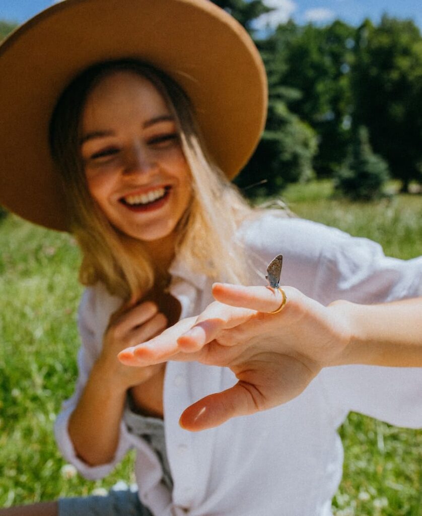 butterfly lands on a woman's hand