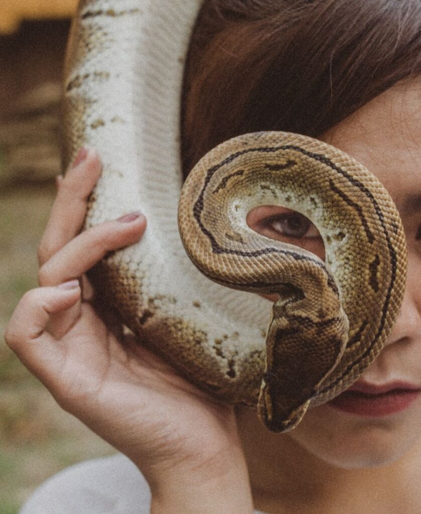 woman with snake in her hand