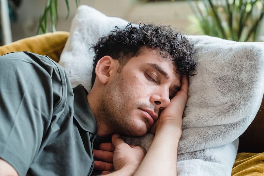 Man sleeping and dreaming about someone calling his name