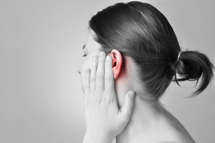 woman with pain in her left ear