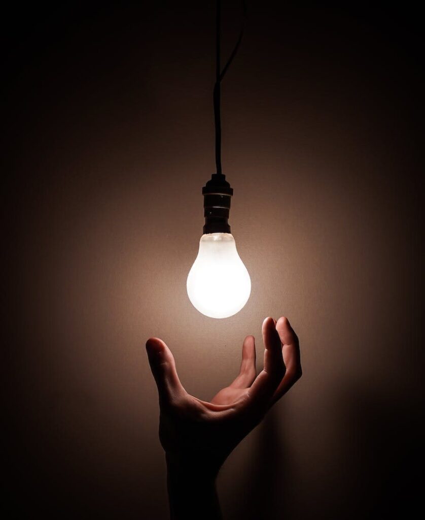 Man changing a blinking light