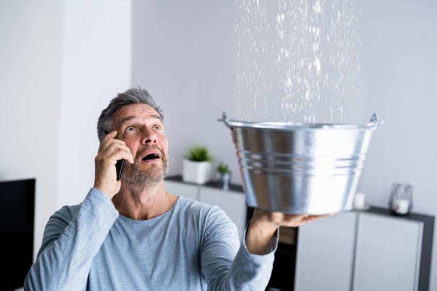 man holding bucket in hand