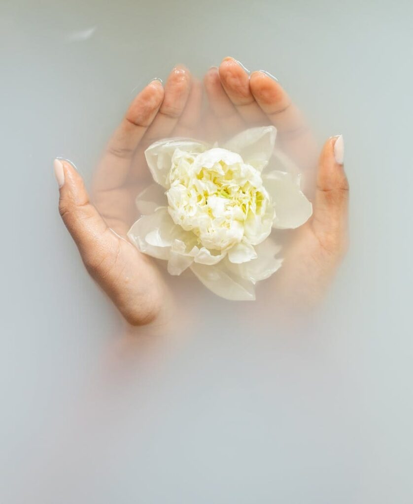 woman with flowers in her hand